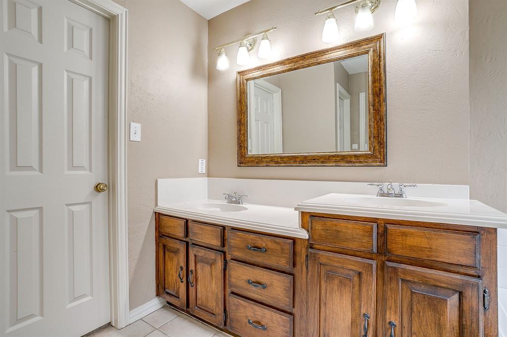 177 Aspen Loop Aledo, TX 76008 - Photo 27 of 40 a bathroom with a sink a vanity and a mirror