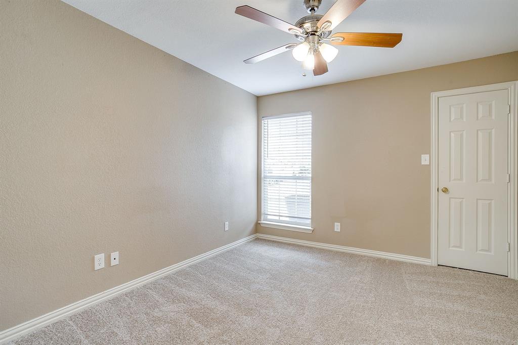 177 Aspen Loop Aledo, TX 76008 - Photo 34 of 40 an empty room with windows and fan