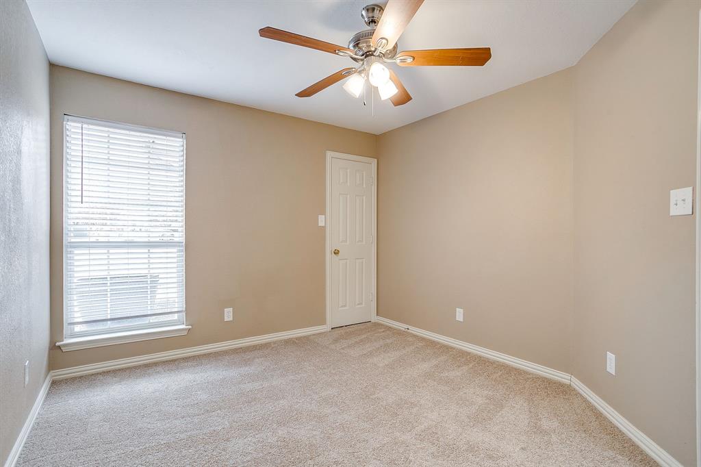 177 Aspen Loop Aledo, TX 76008 - Photo 36 of 40 an empty room with windows and fan