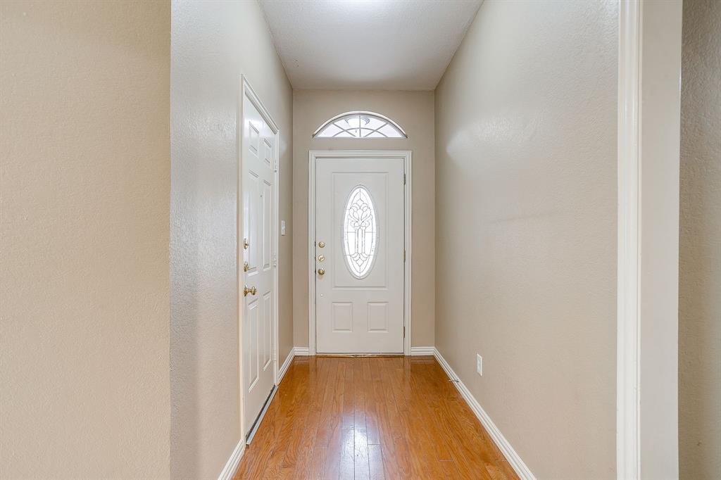 177 Aspen Loop Aledo, TX 76008 - Photo 4 of 40 a view of hallway with wooden floor