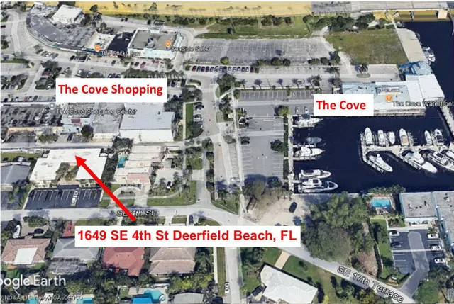 a kitchen with a sink a stove a refrigerator and cabinets