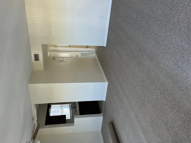 a white refrigerator freezer and a stove sitting inside of a kitchen