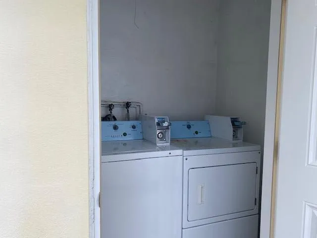 a view of water heater room with a fireplace