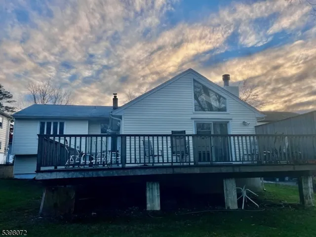 a wooden deck with a yard