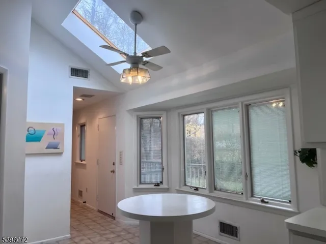 a view of a bathroom with a sink and mirror