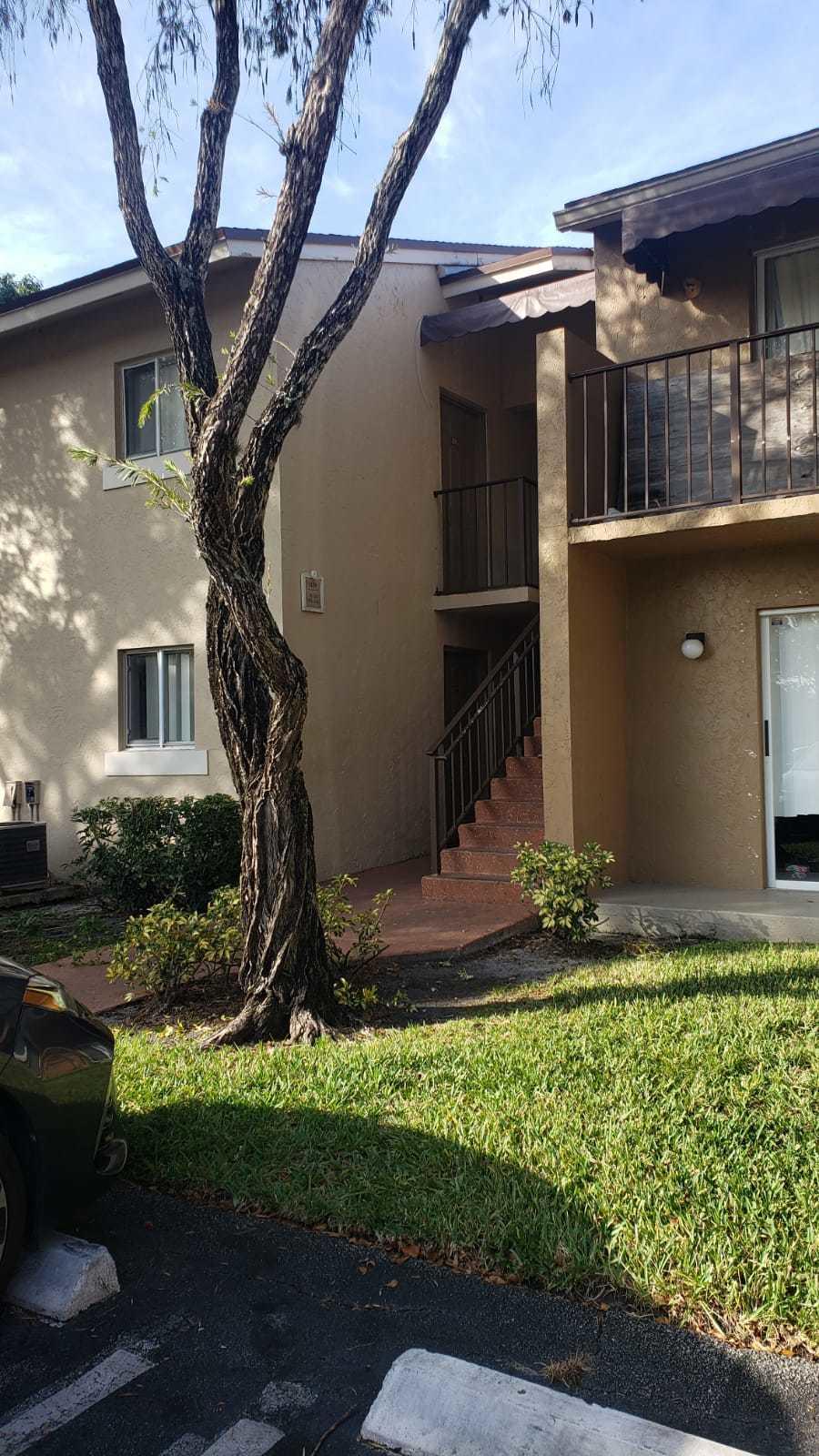 1179 Benoist Farms Road, Unit 102 West Palm Beach, FL 33411 - Photo 3 of 19 Front 2 St Andrews