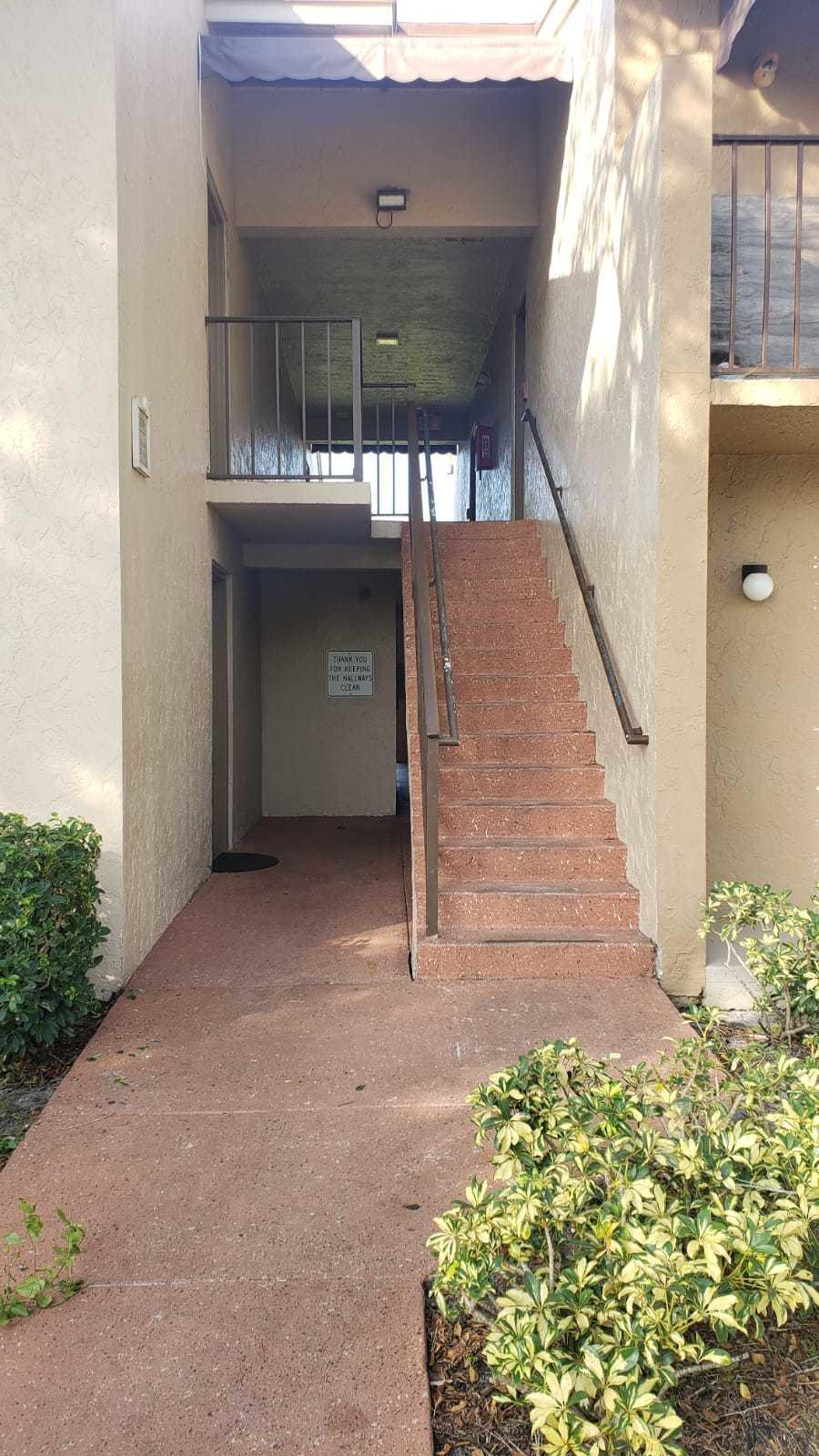 1179 Benoist Farms Road, Unit 102 West Palm Beach, FL 33411 - Photo 4 of 19 Front 3 St Andrews