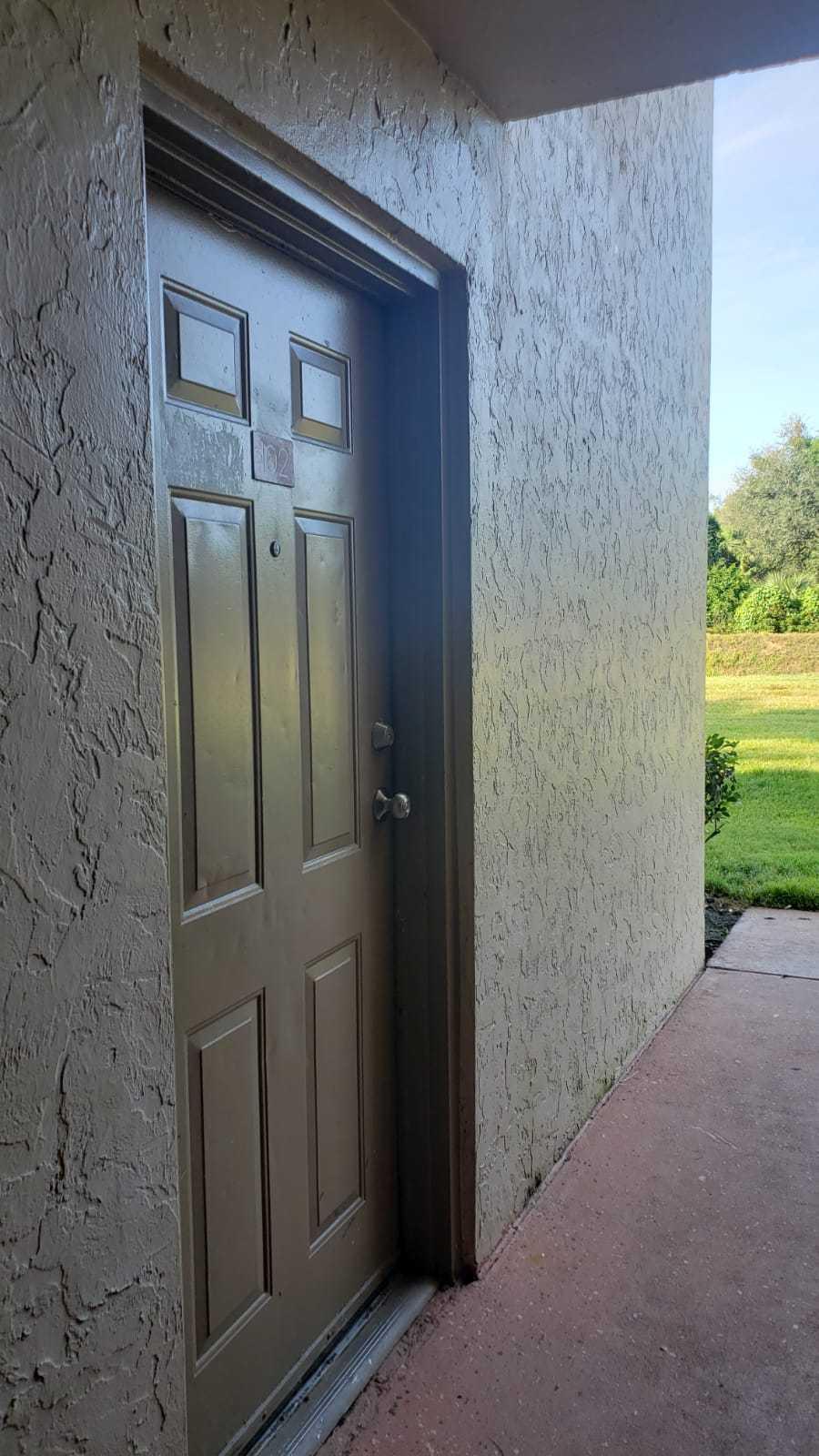 1179 Benoist Farms Road, Unit 102 West Palm Beach, FL 33411 - Photo 5 of 19 Front door St Andrews