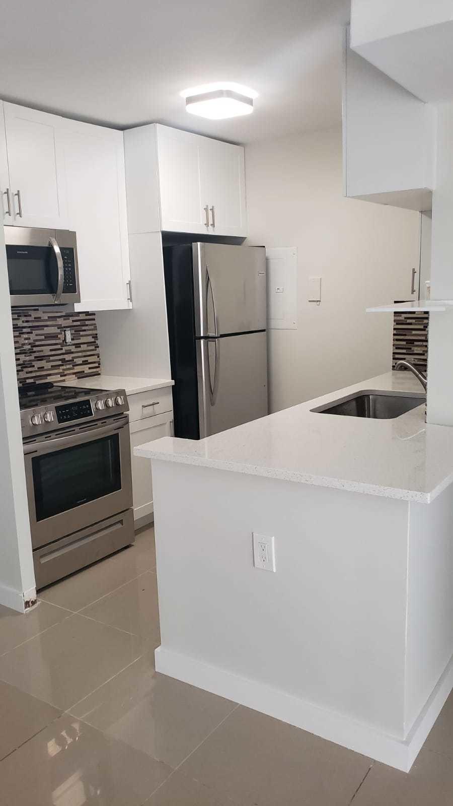 1179 Benoist Farms Road, Unit 102 West Palm Beach, FL 33411 - Photo 6 of 19 Kitchen St Andrews