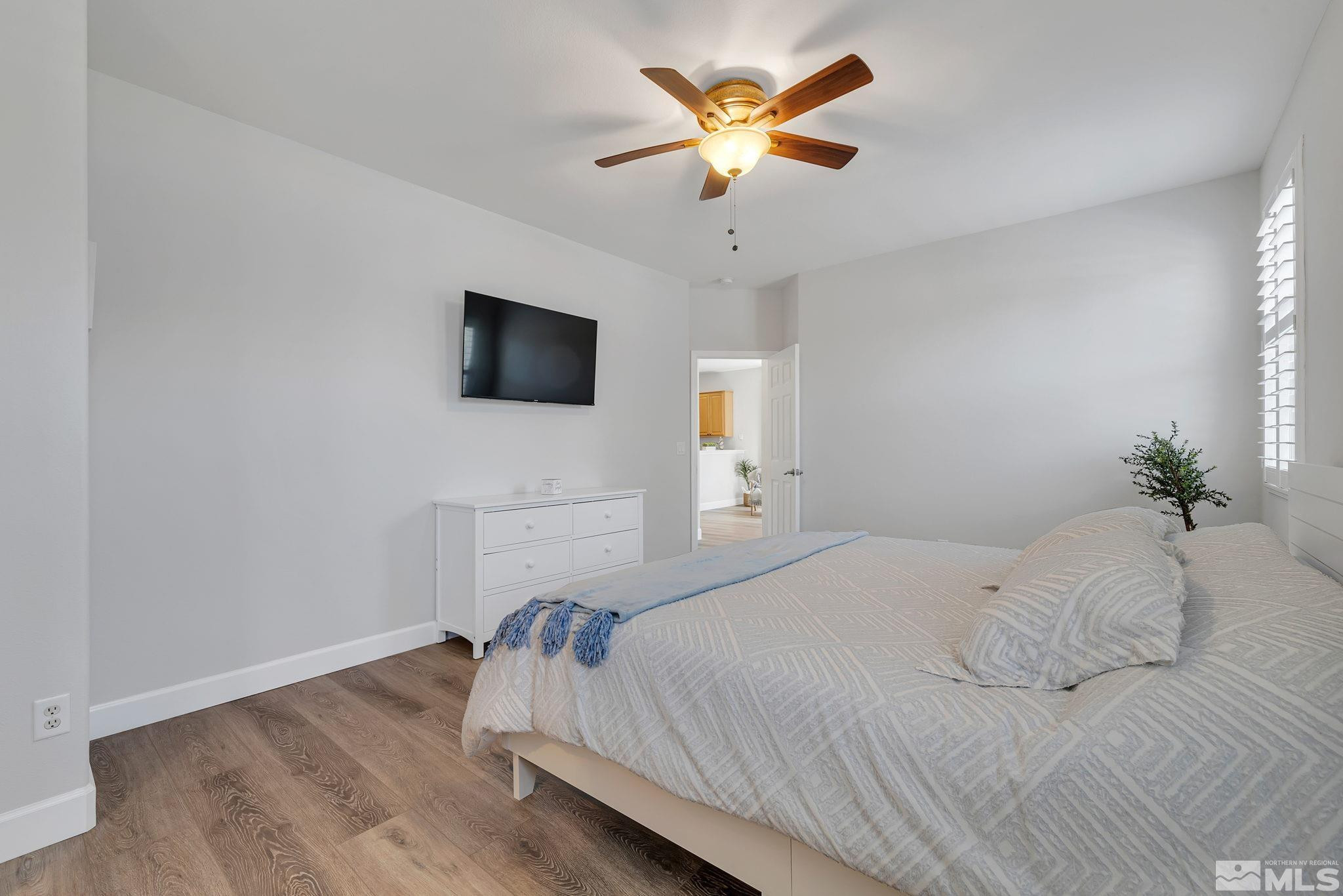 10459 Summershade Lane Reno, NV 89521 - Photo 19 of 37 a bedroom with a bed and a flat screen tv