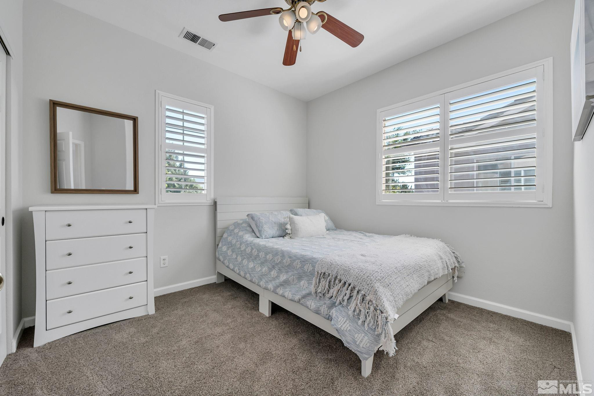 10459 Summershade Lane Reno, NV 89521 - Photo 29 of 37 a bed room with a bed and a dresser