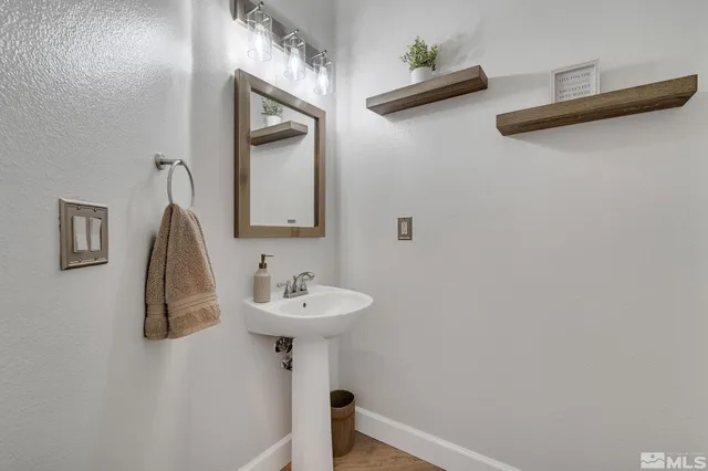 a bathroom with a sink and mirror
