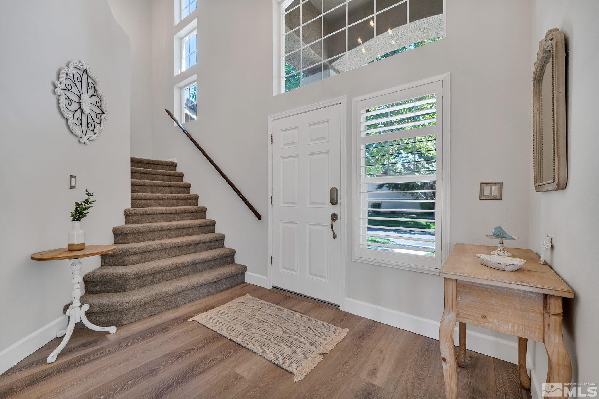 10459 Summershade Lane Reno, NV 89521 - Photo 5 of 37 a view of entryway with stairs and wooden floor