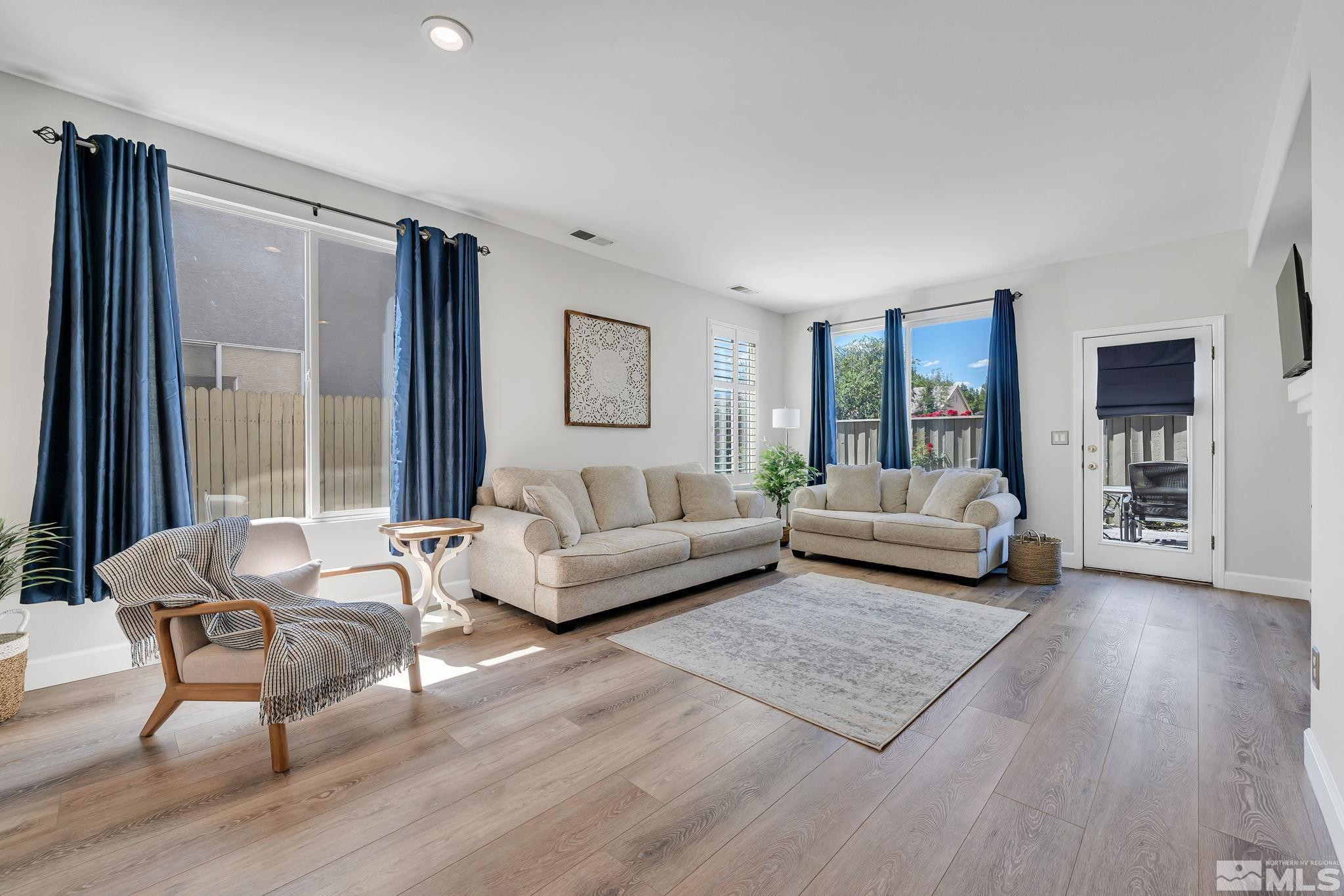 10459 Summershade Lane Reno, NV 89521 - Photo 7 of 37 a living room with furniture and a large window