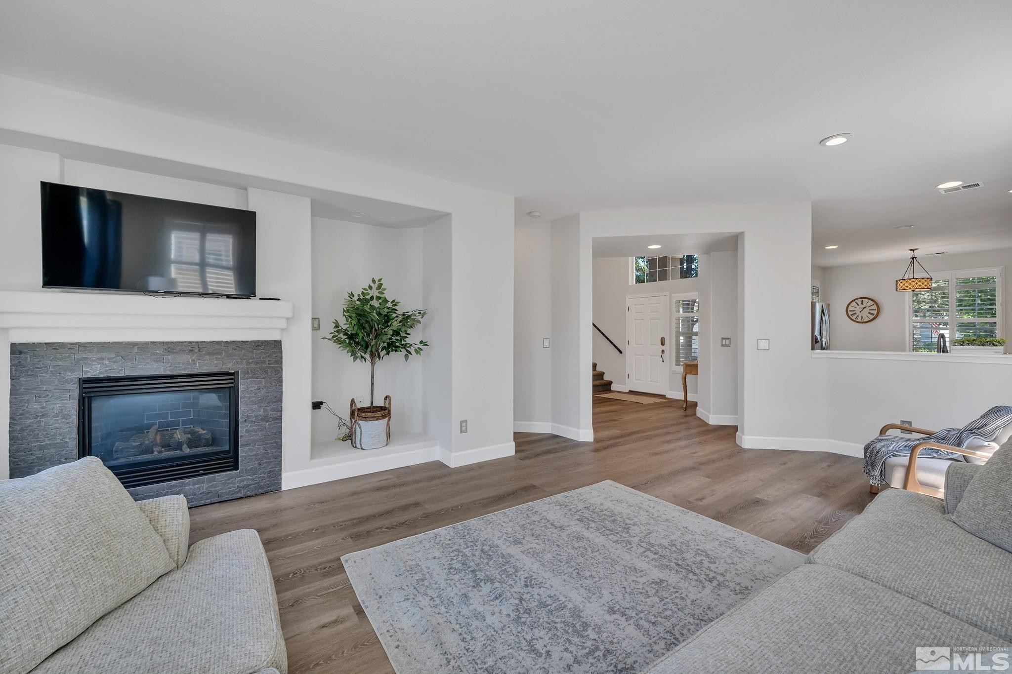 10459 Summershade Lane Reno, NV 89521 - Photo 8 of 37 a living room with furniture and a fireplace