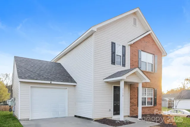 a front view of a house with a garage