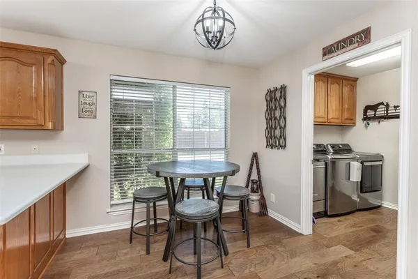 a view of a dining room with furniture and wooden floor