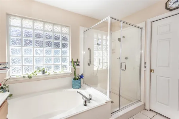 a white bath tub sitting next to a window