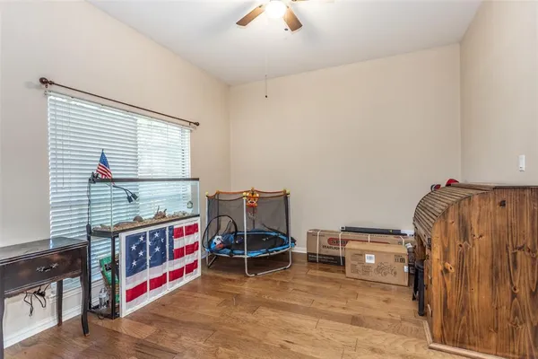 a living room with furniture a air conditioner vent and a window