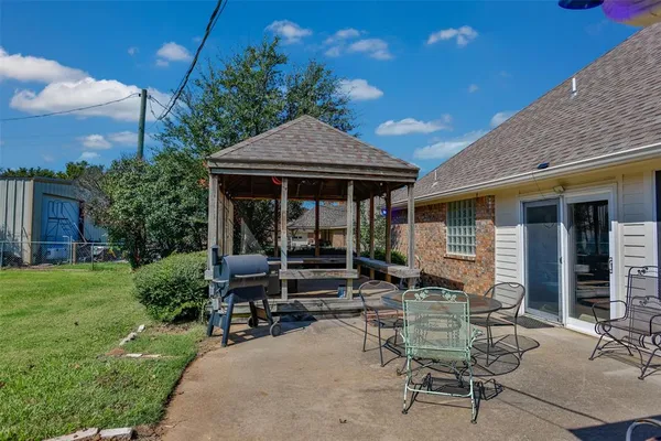 a front view of house with outdoor seating