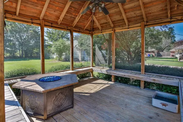 a backyard of a house with outdoor seating