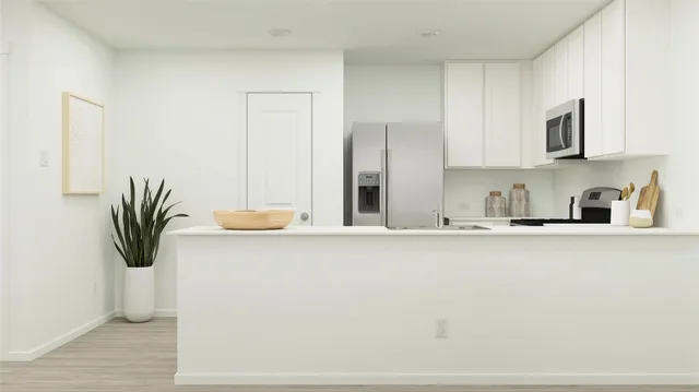 a kitchen with a stove and a microwave