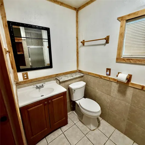 a bedroom with a bed and a rug