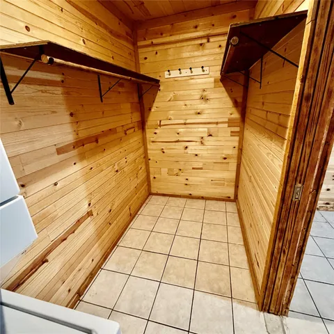 a view of a refrigerator with wooden floor and a sink