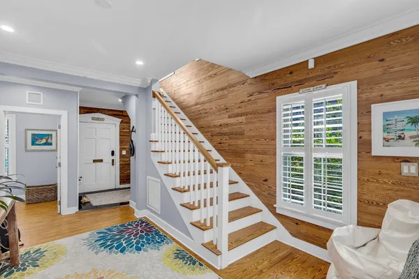 a kitchen with stainless steel appliances granite countertop a sink refrigerator and microwave