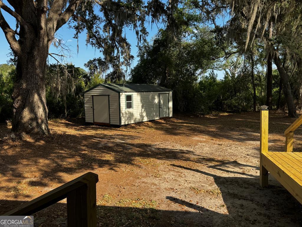 5781 Adams Road Valdosta, GA 31601 - Photo 23 of 27 a front view of a house with garden
