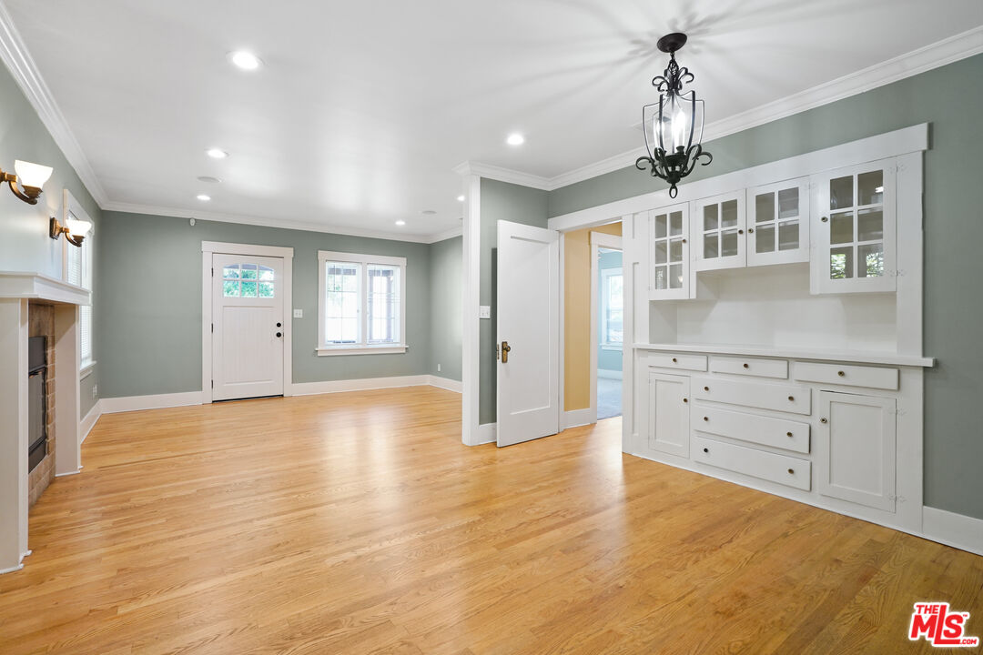 910 Bell Street Pasadena, CA 91104 - Photo 5 of 32 a view of an empty room with window and wooden floor