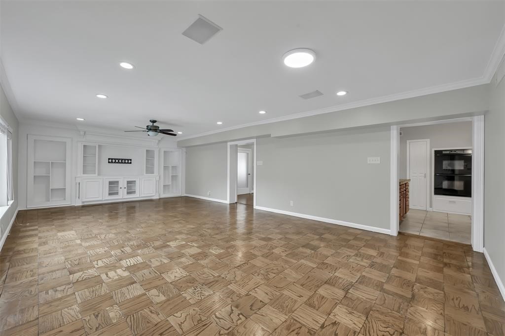 3215 Milburn Street Houston, TX 77021 - Photo 21 of 34 Current family room located in the rear of the home. This space is oversized and perfect for a secondary living area, game room, and entertainment space.
