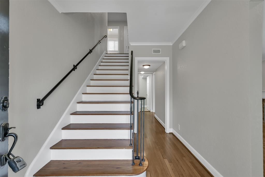 3215 Milburn Street Houston, TX 77021 - Photo 8 of 34 Current view of stairs with hardwood and iron spindles.