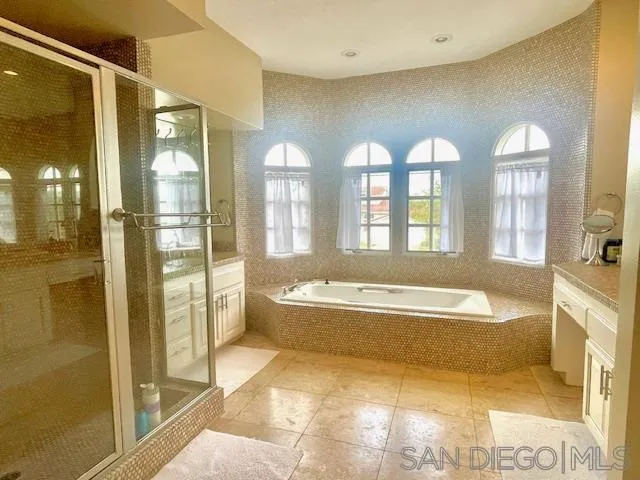 5225 Caminito Providencia Rancho Santa Fe, CA 92067 - Photo 11 of 14 a spacious bathroom with a large tub shower and sink