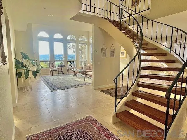 5225 Caminito Providencia Rancho Santa Fe, CA 92067 - Photo 5 of 14 a view of staircase with a rug