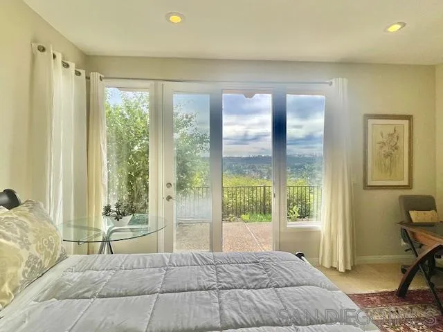 5225 Caminito Providencia Rancho Santa Fe, CA 92067 - Photo 8 of 14 a bedroom with a large window and a bed
