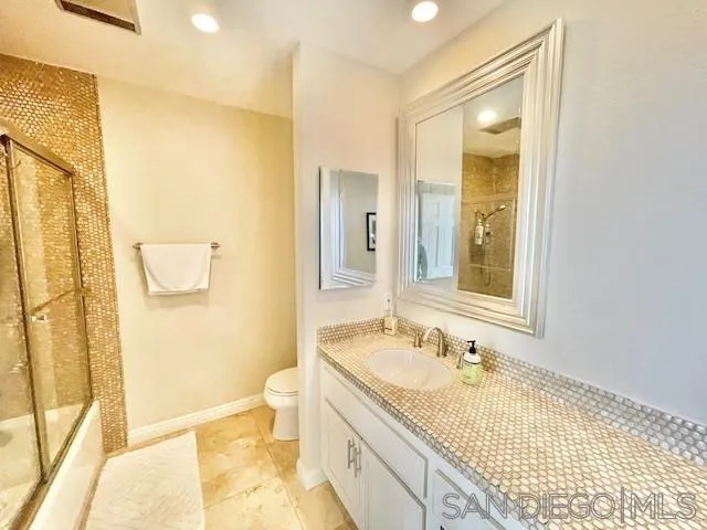 5225 Caminito Providencia Rancho Santa Fe, CA 92067 - Photo 9 of 14 a bathroom with a granite countertop sink toilet and shower