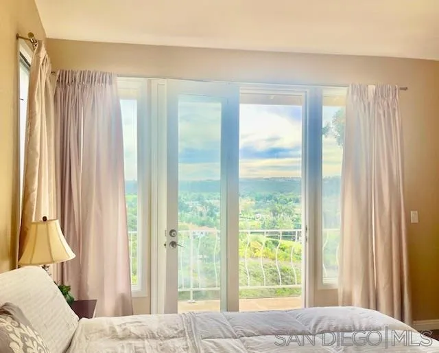 5225 Caminito Providencia Rancho Santa Fe, CA 92067 - Photo 10 of 14 a bedroom with a bed and a window
