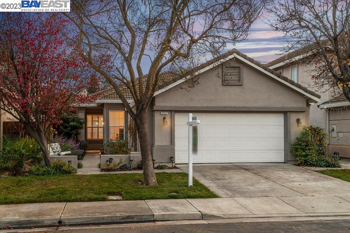3552 Rathbone Way Pleasanton, CA 94588 - Photo 1 of 1 a front view of house with garage and yard
