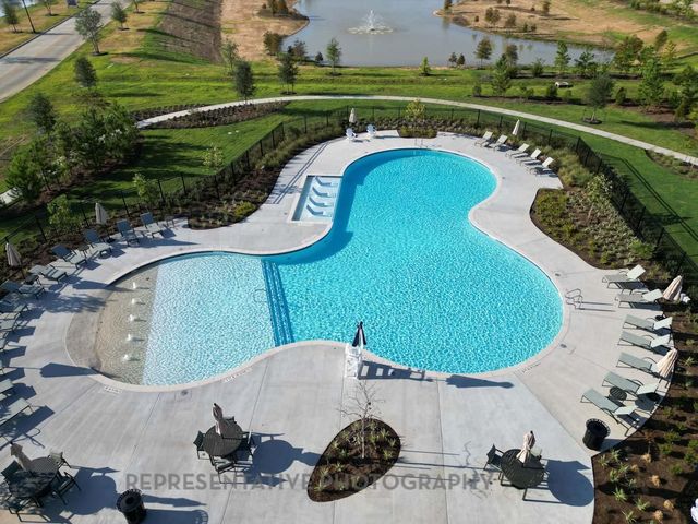 an aerial view of a swimming pool and outdoor space