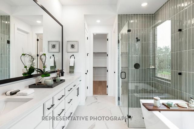 a bathroom with a double vanity sink and mirror