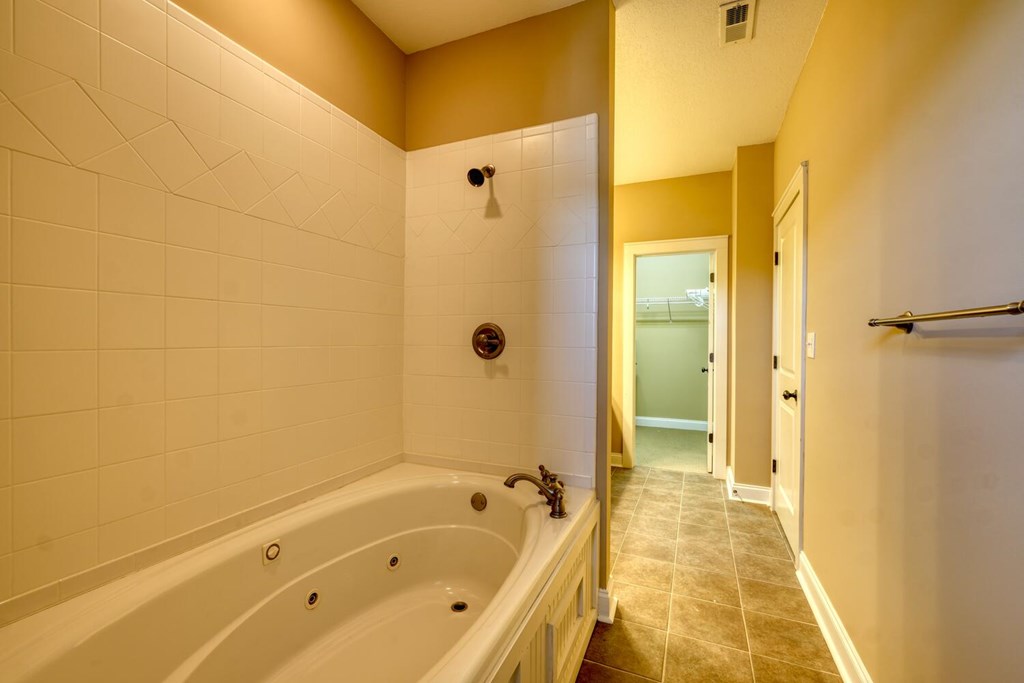 1401 Lakeside Road Hiawassee, GA 30546 - Photo 15 of 46 a bathroom with a tub shower and sink