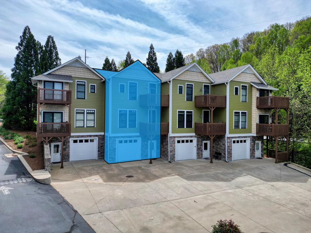 1401 Lakeside Road Hiawassee, GA 30546 - Photo 2 of 46 a front view of a house with a yard