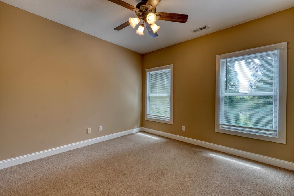 1401 Lakeside Road Hiawassee, GA 30546 - Photo 25 of 46 a view of an empty room with window and chandelier fan