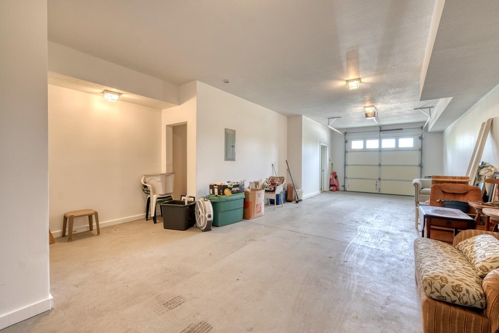 1401 Lakeside Road Hiawassee, GA 30546 - Photo 34 of 46 a living room with furniture and a chandelier