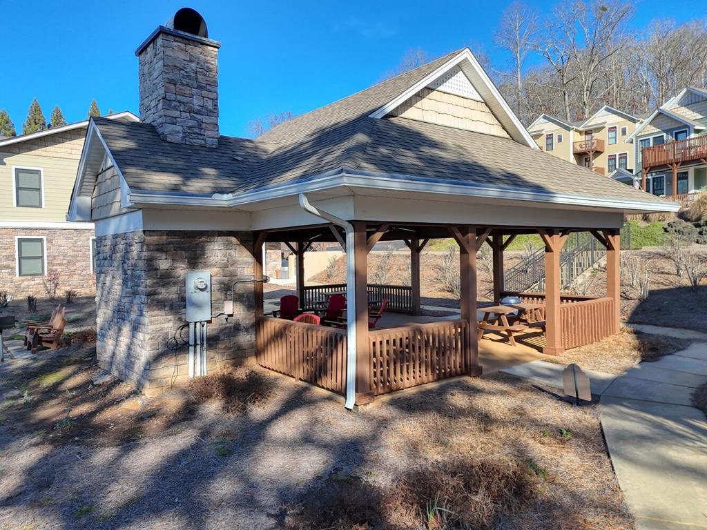 1401 Lakeside Road Hiawassee, GA 30546 - Photo 37 of 46 a view of a patio with a table chairs and a barbeque