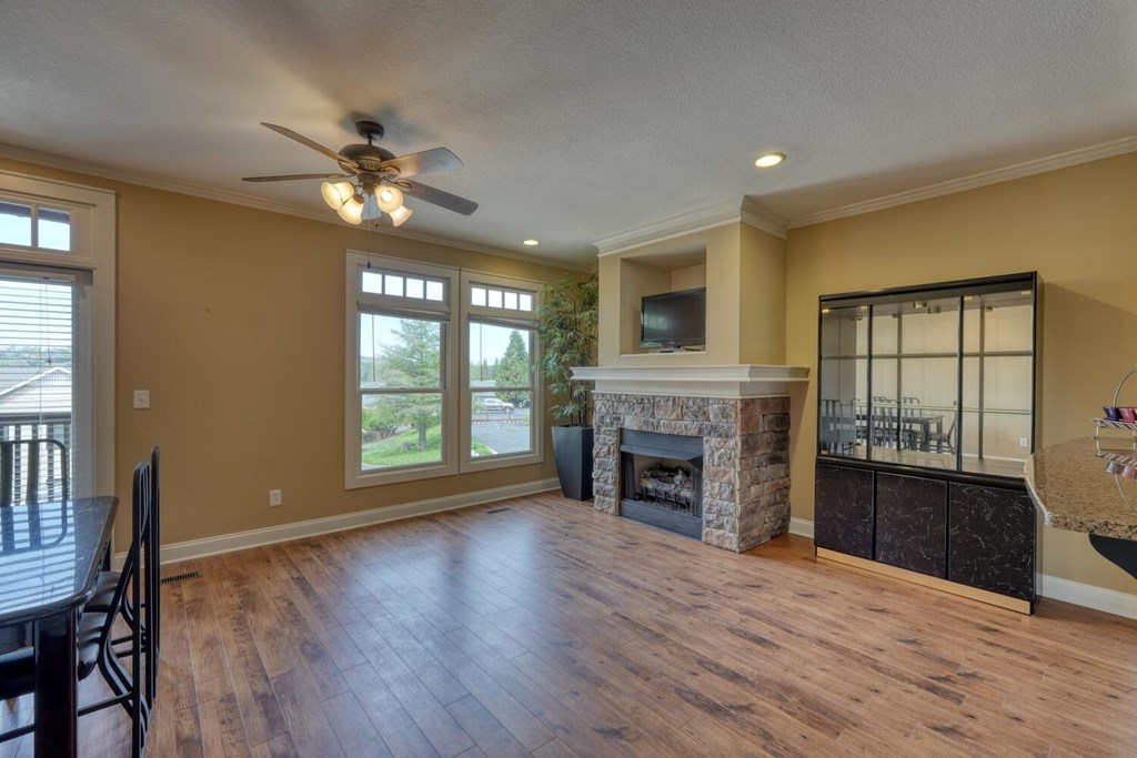 1401 Lakeside Road Hiawassee, GA 30546 - Photo 9 of 46 a view of an empty room with a fireplace and a window
