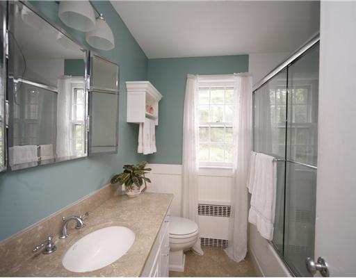 6 Middlesex Road Darien, CT 06820 - Photo 13 of 18 a bathroom with a granite countertop sink toilet a mirror and shower