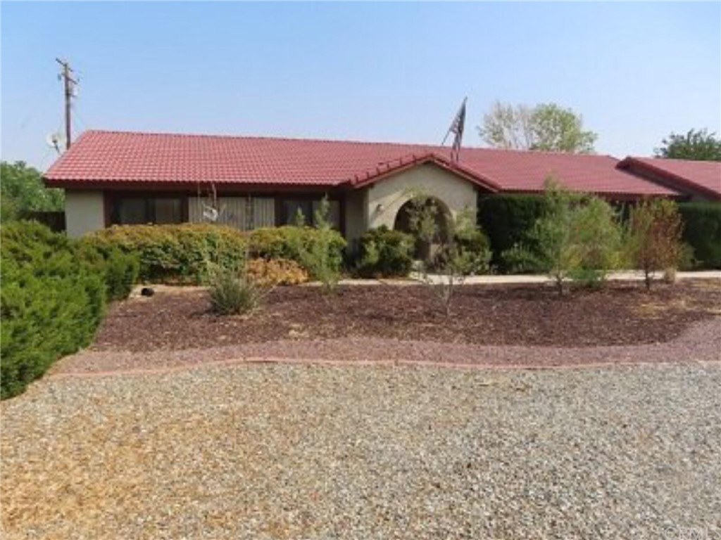 20006 Yucca Loma Road Apple Valley, CA 92307 - Photo 1 of 1 a front view of a house with a yard and garage