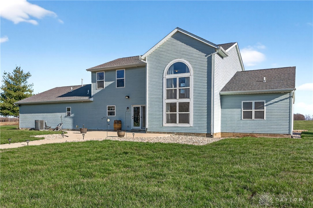 6560 Snyder Road Fletcher, OH 45326 - Photo 48 of 71 This residence features durable vinyl siding and a spacious patio for outdoor enjoyment.